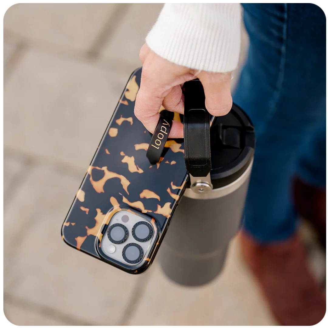 Person holding a Loopy phone case